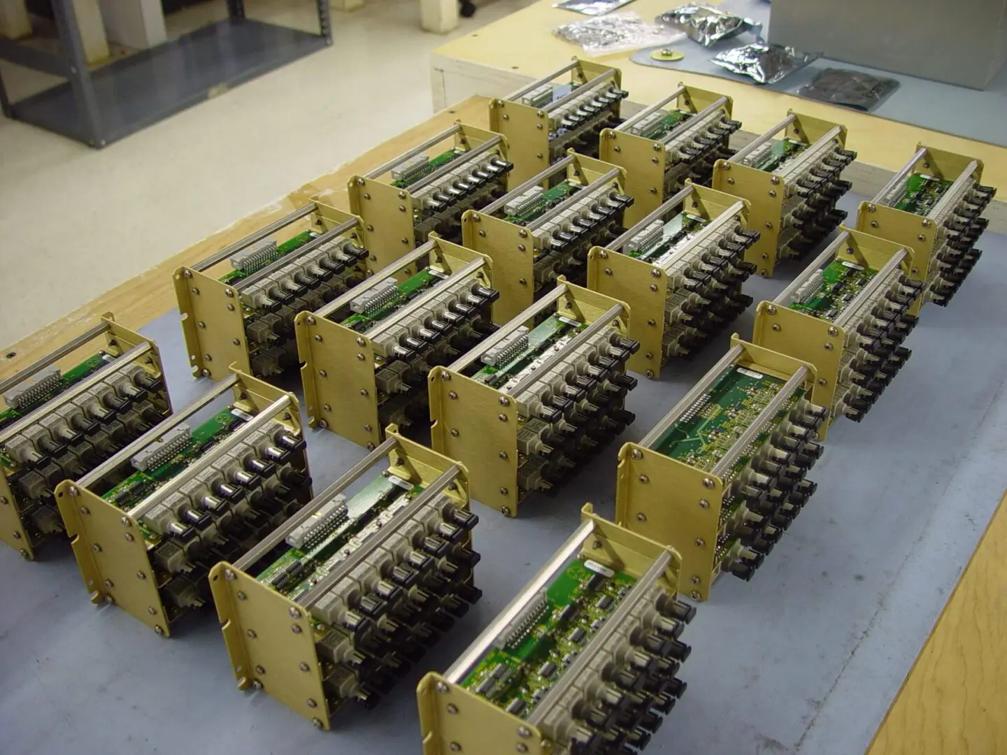 Multiple assembled circuit boards arranged on a floor.