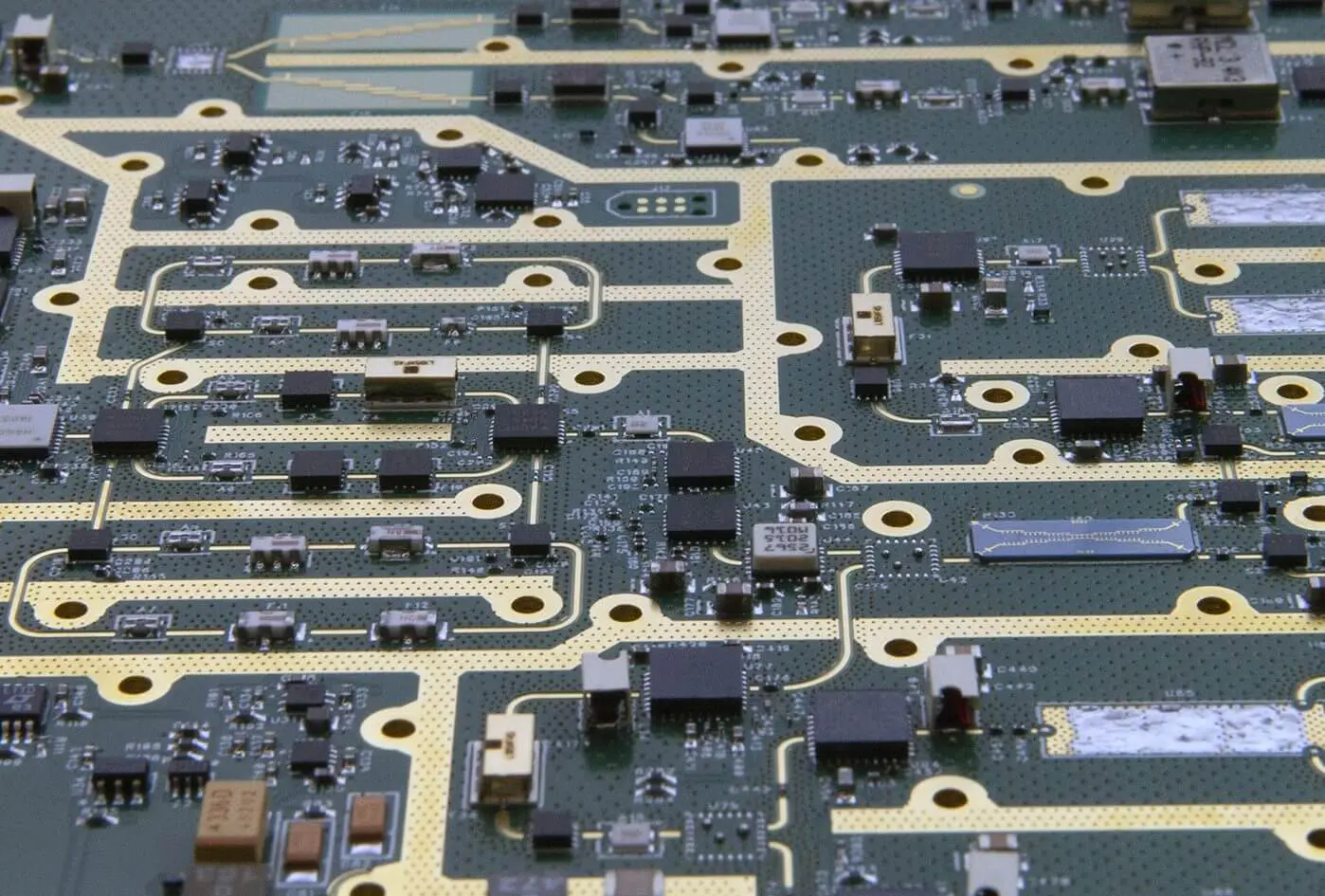 Close-up PCB with gold traces and components